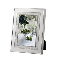 Vera Wang's Blanc Sur Blanc frame features a wide border of vivid silver plate that warmly complements treasured photographs. Vera Wang's Blanc Sur Blanc frame features a wide border of vivid silver plate that warmly complements treasured photographs.