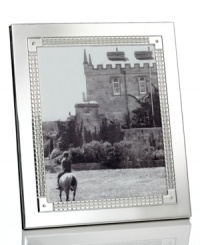 Engraved for timeless style in stainless steel and silver plate, the Watchband picture frame from Lauren Ralph Lauren is a sleek accessory for polished decor. Engraved for timeless style in stainless steel and silver plate, the Watchband picture frame from Lauren Ralph Lauren is a sleek accessory for polished decor.