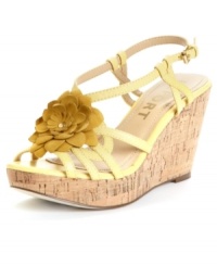 Lounge by the pool in simmering style. The Kinskey wedge sandal from Report blooms with elegance with a rich leather finish and floral accent. Lounge by the pool in simmering style. The Kinskey wedge sandal from Report blooms with elegance with a rich leather finish and floral accent.