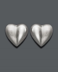 Show your adoration in stylish studs. Crafted in sterling silver, earrings features a sweet, heart-shaped design. Approximate diameter: 1/2 inch.