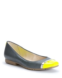 Designer Calvin Klein takes his modern edge into bold, cap toe ballet flats, with metallic accents that define the style. Designer Calvin Klein takes his modern edge into bold, cap toe ballet flats, with metallic accents that define the style.