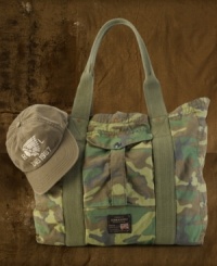 A high-ranking go-to for all your traveling needs, an essential tote bag is crafted from durable cotton ripstop in an effortlessly cool camo print. A high-ranking go-to for all your traveling needs, an essential tote bag is crafted from durable cotton ripstop in an effortlessly cool camo print.