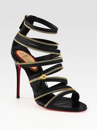 Bands of soft-stretch leather and fierce goldtone zipper trim defines this heightened silhouette. Leather-covered heel, 4 (100mm)Elastic-covered leather upper with zipper trimBack zipLeather liningSignature red leather solePadded insoleMade in Italy Bands of soft-stretch leather and fierce goldtone zipper trim defines this heightened silhouette. Leather-covered heel, 4 (100mm)Elastic-covered leather upper with zipper trimBack zipLeather liningSignature red leather solePadded insoleMade in Italy