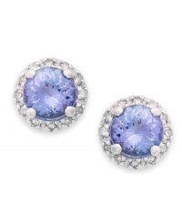 True beauties. These stunning earrings feature round-cut tanzanite (9/10 ct. t.w.) surrounded by halos of round-cut diamonds (1/8 ct. t.w.). Set in sterling silver. Approximate diameter: 7-1/2 mm. True beauties. These stunning earrings feature round-cut tanzanite (9/10 ct. t.w.) surrounded by halos of round-cut diamonds (1/8 ct. t.w.). Set in sterling silver. Approximate diameter: 7-1/2 mm.