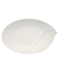 Reshape modern tables with the Flow oval platter, a perfect platform for grand entrees like glazed ham, roast chicken or fish. A fluid, asymmetrical design in white fine china by Villeroy & Boch offers unconventional elegance for every meal and occasion. Reshape modern tables with the Flow oval platter, a perfect platform for grand entrees like glazed ham, roast chicken or fish. A fluid, asymmetrical design in white fine china by Villeroy & Boch offers unconventional elegance for every meal and occasion.