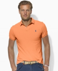 A short-sleeved polo shirt adorned with Ralph Lauren's iconic pony is designed for a relaxed, comfortable fit from breathable cotton mesh. A short-sleeved polo shirt adorned with Ralph Lauren's iconic pony is designed for a relaxed, comfortable fit from breathable cotton mesh.