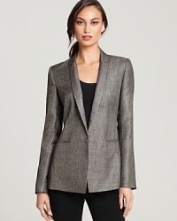 Embrace a bold silhouette as menswear tailoring lends commanding presence to this Elie Tahari jacket, finished with metallic threading for an on-trend touch of shine. Embrace a bold silhouette as menswear tailoring lends commanding presence to this Elie Tahari jacket, finished with metallic threading for an on-trend touch of shine.