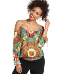 Oh-so trend-forward, this scarf-print blouson top comes fully equipped with shoulder-flaunting cutouts and chic getaway style! Oh-so trend-forward, this scarf-print blouson top comes fully equipped with shoulder-flaunting cutouts and chic getaway style!