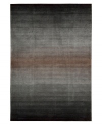 An ombré ground of soothing grays evokes mysterious allure in this area rug from Nourison. Hand tufted of long polyester fibers for added strength and softness, the Contour area rug creates an ideal accent for any modern room. (Clearance) An ombré ground of soothing grays evokes mysterious allure in this area rug from Nourison. Hand tufted of long polyester fibers for added strength and softness, the Contour area rug creates an ideal accent for any modern room. (Clearance)