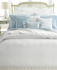 A vintage scroll pattern in a muted blue and white palette adorns this fitted sheet from Lauren Ralph Lauren for a traditional and elegant allure. A vintage scroll pattern in a muted blue and white palette adorns this fitted sheet from Lauren Ralph Lauren for a traditional and elegant allure.