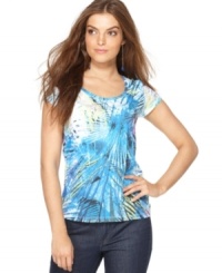 Layers of palm fronds create the colorful print that adds a cool touch to Calvin Klein Jeans' essential scoopneck tee. Layers of palm fronds create the colorful print that adds a cool touch to Calvin Klein Jeans' essential scoopneck tee.