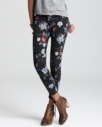 A floral print decorates Current/Elliott's skinny jeans for a cool take on the latest denim trend. Work the low-rise style in downtown fashion-think ankle boots and an asymmetric top. A floral print decorates Current/Elliott's skinny jeans for a cool take on the latest denim trend. Work the low-rise style in downtown fashion-think ankle boots and an asymmetric top.