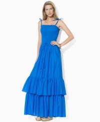Rendered in airy cotton voile for a full, floaty silhouette, Lauren by Ralph Lauren's graceful maxi dress is designed with a flattering smocked bodice and a two-tiered ruffled hem for whimsical appeal. Rendered in airy cotton voile for a full, floaty silhouette, Lauren by Ralph Lauren's graceful maxi dress is designed with a flattering smocked bodice and a two-tiered ruffled hem for whimsical appeal.