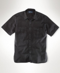 Tailored in soft tissue chino for a well-worn sensibility, a short-sleeved sport shirt is cut in a classic, comfortable fit with military-inspired details. Tailored in soft tissue chino for a well-worn sensibility, a short-sleeved sport shirt is cut in a classic, comfortable fit with military-inspired details.