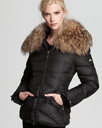 An oversized fur collar lends luxurious style to this plush down jacket from Dawn Levy. An oversized fur collar lends luxurious style to this plush down jacket from Dawn Levy.