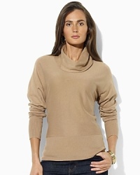 A chic cowl neckline and dolman sleeves modernize a sleek sweater, crafted in an ultra-soft cotton-modal blend. A chic cowl neckline and dolman sleeves modernize a sleek sweater, crafted in an ultra-soft cotton-modal blend.