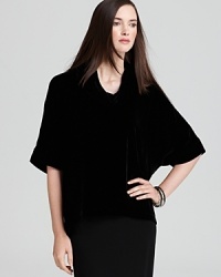 Go va va voom in a plush velvet Eileen Fisher top, artfully draped with a chic cowl neckline for effortless elegance. Go va va voom in a plush velvet Eileen Fisher top, artfully draped with a chic cowl neckline for effortless elegance.
