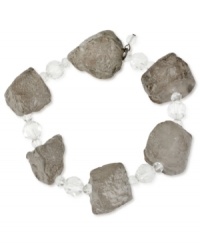 Look like a rock star. This stretch bracelet from Kenneth Cole New York is crafted from hematite-tone mixed metal with semi-precious geometric stones adding an edge and clear glass faceted beads providing the luster. Approximate length: 7-1/2 inches. Look like a rock star. This stretch bracelet from Kenneth Cole New York is crafted from hematite-tone mixed metal with semi-precious geometric stones adding an edge and clear glass faceted beads providing the luster. Approximate length: 7-1/2 inches.