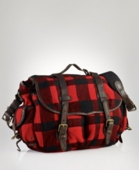 Leather accents and ample pockets lend rugged utilitarian appeal to a messenger bag in buffalo-checked wool. Leather accents and ample pockets lend rugged utilitarian appeal to a messenger bag in buffalo-checked wool.