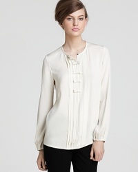 Feminine, elegant, and classic, this DIANE von FURSTENBERG top of supple silk possesses all the characteristics of a wardrobe staple. Feminine, elegant, and classic, this DIANE von FURSTENBERG top of supple silk possesses all the characteristics of a wardrobe staple.