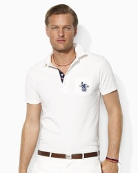Accented with subtle heritage details, a short-sleeved polo shirt is designed for a comfortable, relaxed fit from breathable cotton mesh. Accented with subtle heritage details, a short-sleeved polo shirt is designed for a comfortable, relaxed fit from breathable cotton mesh.