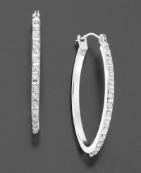 Make a glittering statement. A seamless row of diamond accents are set along this elegant oval-shaped hoop. Crafted in 14k white gold. Approximate diameter: 1-3/4 inches. Make a glittering statement. A seamless row of diamond accents are set along this elegant oval-shaped hoop. Crafted in 14k white gold. Approximate diameter: 1-3/4 inches.