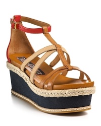 Part gladiator sandal, part espadrille, these Juicy Couture wedges span the realm of footwear with a nod to nautical inspiration. Part gladiator sandal, part espadrille, these Juicy Couture wedges span the realm of footwear with a nod to nautical inspiration.