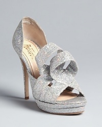 The mercury is rising: these silvery, glittering evening pumps are sure to be the life of every party on the social scene: from designer Jerome C. Rousseau. The mercury is rising: these silvery, glittering evening pumps are sure to be the life of every party on the social scene: from designer Jerome C. Rousseau.
