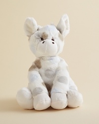 An adorable giraffe doll is adorned with playful dots. An adorable giraffe doll is adorned with playful dots.