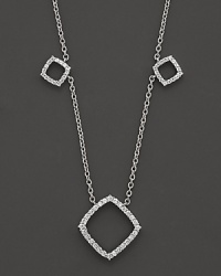 Diamonds encrust 14K white gold stations in elegant geometric shapes. Diamonds encrust 14K white gold stations in elegant geometric shapes.