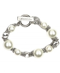 Wrap your wrists in something luxurious. Givenchy's sophisticated flex bracelet features white glass pearls and sparkling crystals set in silver tone mixed metal. Bracelet features a toggle closure. Approximate length: 7-1/2 inches. Wrap your wrists in something luxurious. Givenchy's sophisticated flex bracelet features white glass pearls and sparkling crystals set in silver tone mixed metal. Bracelet features a toggle closure. Approximate length: 7-1/2 inches.