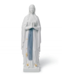A soothing presence, Our Lady of Lourdes is draped in layers of beautiful white with a sash of blue about her waist, all in handcrafted Lladro porcelain. A soothing presence, Our Lady of Lourdes is draped in layers of beautiful white with a sash of blue about her waist, all in handcrafted Lladro porcelain.