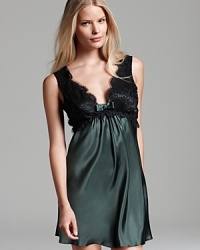 Black lace overlay gives this silky Flora Nikrooz chemise a polished appearance. Black lace overlay gives this silky Flora Nikrooz chemise a polished appearance.