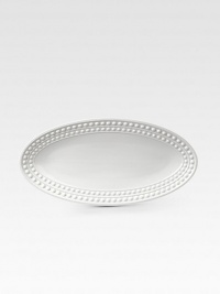 An elegantly detailed serving platter is made entirely by hand in fine Limoges porcelain with a raised pearl detail. From the Perlee White Collection Porcelain 14 X 7 Dishwasher safe Imported An elegantly detailed serving platter is made entirely by hand in fine Limoges porcelain with a raised pearl detail. From the Perlee White Collection Porcelain 14 X 7 Dishwasher safe Imported