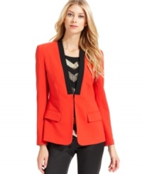 Vince Camuto crafts a bold blazer with a collarless silhouette and a contrasting faux lapel. Vince Camuto crafts a bold blazer with a collarless silhouette and a contrasting faux lapel.