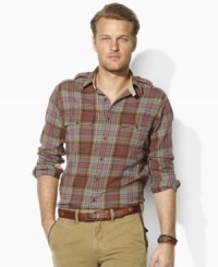 Ideal as a layering piece or perfectly rugged on its own, this trim-fitting military shirt is rendered from supremely soft flannel in a classic plaid print. Ideal as a layering piece or perfectly rugged on its own, this trim-fitting military shirt is rendered from supremely soft flannel in a classic plaid print.