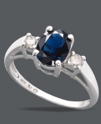 Add a simple touch of royalty to your look. This stunning, three stone ring highlights an oval-cut sapphire center stone (1-1/2 ct. t.w.) with round-cut diamonds (1/5 ct. t.w.) at the shoulders. Crafted in sterling silver. Size 7.