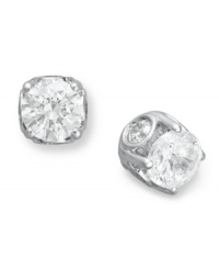 Traditional diamond stud earrings with an intricate twist. Each pair features a bezel-set diamond in the side, as well as a round-cut diamond at front (total 2 ct. t.w.). Crafted in a 14k white gold post setting. Approximate diameter: 6 mm.
