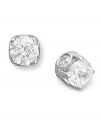 Traditional diamond stud earrings with an intricate twist. Each pair features a bezel-set diamond in the side, as well as a round-cut diamond at front (total 2 ct. t.w.). Crafted in a 14k white gold post setting. Approximate diameter: 6 mm. Traditional diamond stud earrings with an intricate twist. Each pair features a bezel-set diamond in the side, as well as a round-cut diamond at front (total 2 ct. t.w.). Crafted in a 14k white gold post setting. Approximate diameter: 6 mm.