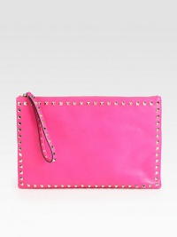 An edgy design with modern appeal in supple leather with pyramid stud details.Wristlet strap, 7 dropTop zip closureOne inside zip pocketTwo inside open pocketsCanvas lining13½W X 8¾H X ½DMade in Italy An edgy design with modern appeal in supple leather with pyramid stud details.Wristlet strap, 7 dropTop zip closureOne inside zip pocketTwo inside open pocketsCanvas lining13½W X 8¾H X ½DMade in Italy