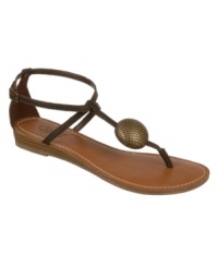 Minimalistic with a dramatic centerpiece. Carlos by Carlos Santana's Tatiana flat sandals feature a single strap vamp with a metallic round ornament at the vamp. Minimalistic with a dramatic centerpiece. Carlos by Carlos Santana's Tatiana flat sandals feature a single strap vamp with a metallic round ornament at the vamp.