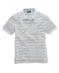 Rendered in lightweight, breathable cotton jersey, this classic polo design features a multicolored striped design for handsome appeal. Rendered in lightweight, breathable cotton jersey, this classic polo design features a multicolored striped design for handsome appeal.