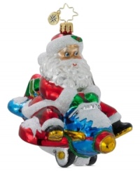 Spirits will soar with Christopher Radko's Jet Set Santa ornament. St. Nick pilots a toy plane outfitted with shiny red wings and handcrafted in Polish glass. Spirits will soar with Christopher Radko's Jet Set Santa ornament. St. Nick pilots a toy plane outfitted with shiny red wings and handcrafted in Polish glass.