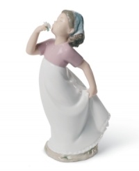 A young girl welcomes the first scent of spring in this charming handmade porcelain figure from Lladró. A young girl welcomes the first scent of spring in this charming handmade porcelain figure from Lladró.