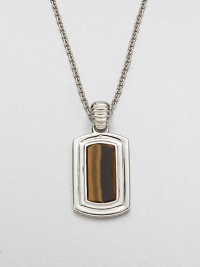 Shiny sterling silver frames a center tigers' eye stone, handsomely suspended from a link chain.Sterling silverTigers' eyeLength, about 22Pendant size, about 1 x ½Imported
