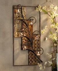 Textured and cutout designs add contrast to your walls and are brilliantly set off by metal leaves and swirls. A multitude of votive candles light up the golden tones of this statement maker. Textured and cutout designs add contrast to your walls and are brilliantly set off by metal leaves and swirls. A multitude of votive candles light up the golden tones of this statement maker.