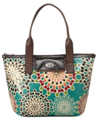 Shake up your everyday accessorizing with this mod tote design from Fossil. Durable coated canvas is outfitted with a cool kaleidoscope of colors, while the sturdy shoulder straps and roomy interior let you take along everything with ease. Shake up your everyday accessorizing with this mod tote design from Fossil. Durable coated canvas is outfitted with a cool kaleidoscope of colors, while the sturdy shoulder straps and roomy interior let you take along everything with ease.