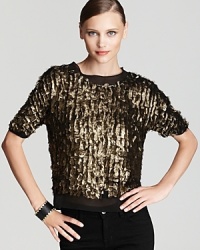 Made from weightless silk and embellished with shiny, metallic gold laser-cut circles, our latest DIANE von FURSTENBERG top gives new meaning to going for the gold. Made from weightless silk and embellished with shiny, metallic gold laser-cut circles, our latest DIANE von FURSTENBERG top gives new meaning to going for the gold.