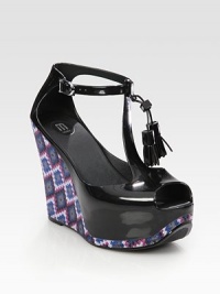 Chunky printed wedge with an adjustable t-strap, tassel laces and a slight peep toe. Self-covered wedge, 5 (125mm)Self-covered platform, 1½ (40mm)Compares to a 3½ heel (90mm)Rubber upperRubber lining and solePadded insoleImportedOUR FIT MODEL RECOMMENDS ordering one half size down as this style runs large. Chunky printed wedge with an adjustable t-strap, tassel laces and a slight peep toe. Self-covered wedge, 5 (125mm)Self-covered platform, 1½ (40mm)Compares to a 3½ heel (90mm)Rubber upperRubber lining and solePadded insoleImportedOUR FIT MODEL RECOMMENDS ordering one half size down as this style runs large.