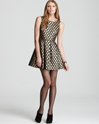 Frock around the clock in a flared VINCE CAMUTO party dress, flecked with gilded polka dots for 24-7 spotlight style. Juxtapose the feminine silhouette with a structured leather jacket for a rocker-luxe look.